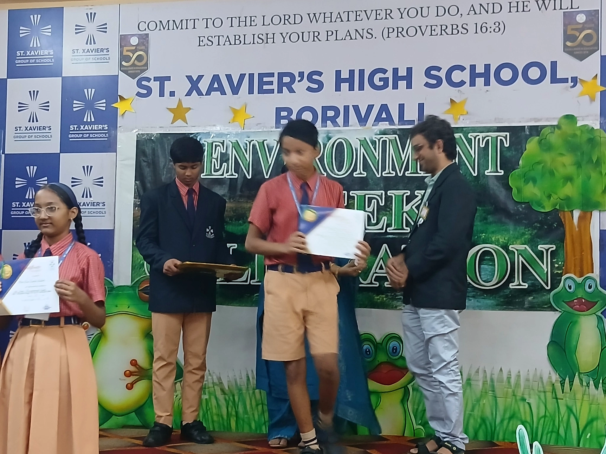 Students receiving recognition during an event